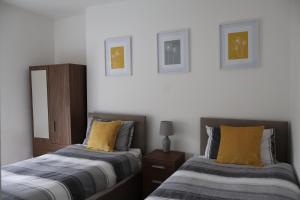 Ένα ή περισσότερα κρεβάτια σε δωμάτιο στο Golwg y Mynydd