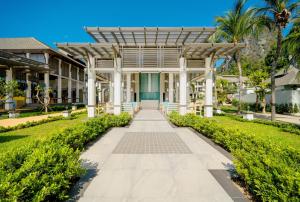 a walkway in front of a building at Bhu Nga Thani Resort & Villas Railay in Railay Beach