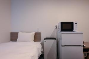 En TV eller et underholdningssystem på HOTEL R9 The Yard Matsusaka