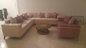 a living room with a couch and two chairs at Joli Appartment A Zitouna 2 in Port El Kantaoui