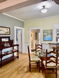 a living room with a table and chairs at Southern Comfort in Tallahassee