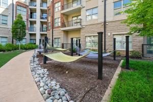 a couple of hammocks in front of a building at Uptown 4th Ward Luxury Apt Year-Round Pool in Charlotte
