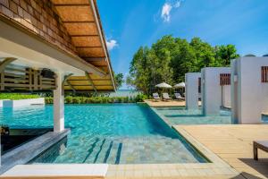an infinity pool at a villa with a resort at Bhu Nga Thani Resort & Villas Railay in Railay Beach
