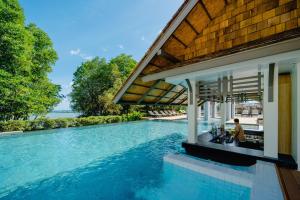 a swimming pool in the middle of a house at Bhu Nga Thani Resort & Villas Railay in Railay Beach