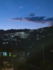 a view of a city lit up at night at Zangmo Lee Baam Rezay gangtok Sikkim in Gangtok