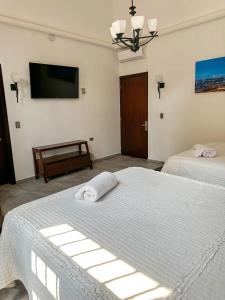 Voodi või voodid majutusasutuse Hotel Asís toas