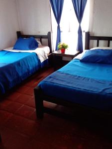 Cama o camas de una habitación en Hotel Campestre Mirador De San Nicolas