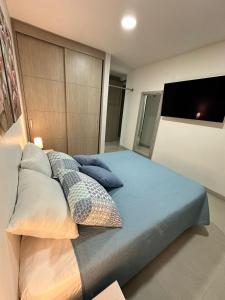 Un ou plusieurs lits dans un hébergement de l'établissement Apartamento Luxury 2 Habitaciones