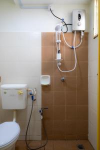 a bathroom with a shower with a toilet in it at Adno Homestay Seroja#3BR#5 Single#IKEA#High Speed Wifi#5pax in Simpang Ampat