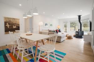 a dining room and living room with a table and chairs at The Blackcomb Ski-In Getaway in Whistler