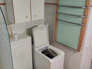 a small bathroom with a toilet with a mirror at Appartement Les Gets, 1 pièce, 4 personnes - FR-1-671-257 in Les Gets