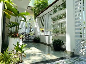 a courtyard with potted plants in a building at The Hygge House in Da Nang