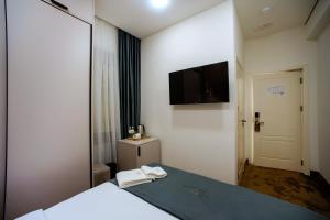 Letto o letti in una camera di The House Hotel Yerevan