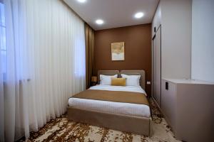 Letto o letti in una camera di The House Hotel Yerevan