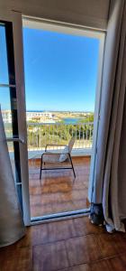 a view of a balcony with a bench on a porch at Apartamento 204 Castell Sol CB in Arenal d'en Castell