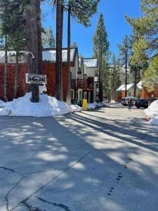 a street with a street sign in the snow at Tahoe Haven: Your Retreat Awaits in Incline Village