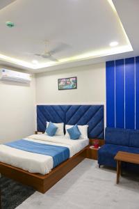 Ліжко або ліжка в номері Hotel Aagman - Anand