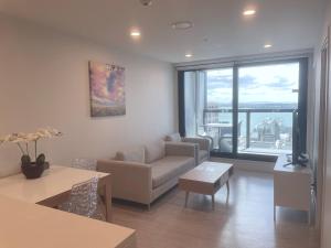 Istumisnurk majutusasutuses Gorgeous High Floor Skytower view 2 Bedroom Apartment in Auckland CBD