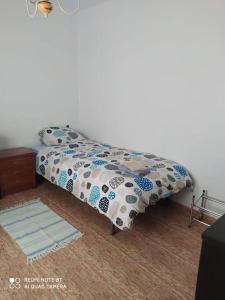 En eller flere senge i et værelse på Apartamento Aviles, Centro ciudad