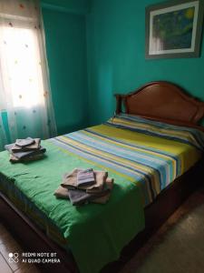 En eller flere senge i et værelse på Apartamento Aviles, Centro ciudad
