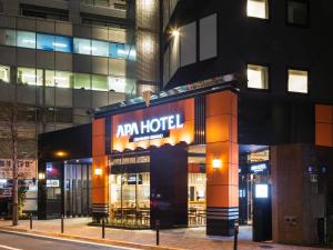 a building with a sign that reads ra hotel at APA Hotel Iidabashi Ekimae in Tokyo