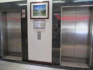 a door that is open on the side of a train at Springwood Tower Apartment Hotel in Springwood