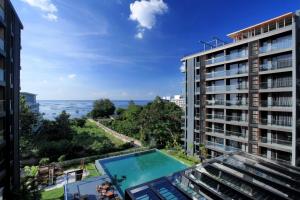 a view of the ocean from a building at Balcony Seaside Sriracha Hotel & Serviced Apartments in Si Racha