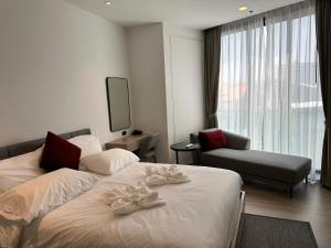 Ένα ή περισσότερα κρεβάτια σε δωμάτιο στο EDGE Central Pattaya