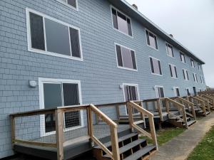 a building with a ramp leading up to it at West Beach Suites in Lincoln City