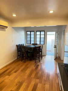 a kitchen and dining room with a table and chairs at Cozy Home in Prime Location in Monterey Park