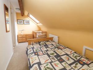 a bedroom with a bed in a room at Dragon's Den in Chester