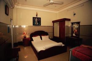 Ένα ή περισσότερα κρεβάτια σε δωμάτιο στο Tan Dat Hoa Hotel & Massage