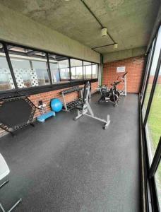 a gym with several exercise equipment in a building at Artistic Apartment in Zone 4 in Guatemala