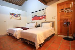 Postel nebo postele na pokoji v ubytování Yong Le Homestay + 74 fotografií