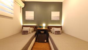 Posteľ alebo postele v izbe v ubytovaní OYO Hostel Dongdaemun1