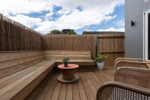 a patio with a table and a fence at Home sweet home with secure parking in Franklin Village