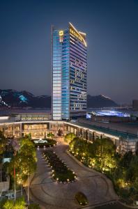 a large building with lights in front of it at Shangri-La Wenzhou in Wenzhou