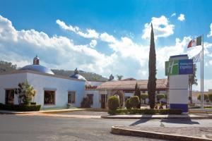 a hotel with a sign in front of a building at Holiday Inn Express Morelia by IHG in Morelia
