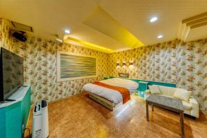 Giường trong phòng chung tại Hotel Cordon -Adult Only