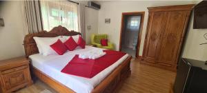 Postel nebo postele na pokoji v ubytování Benjamine's Guesthouse