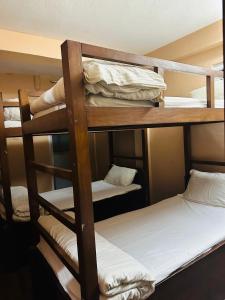 a group of bunk beds in a room at Hotel Travelers Home in Kathmandu