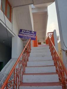 a staircase leading up to a building with a sign on it at KKA RESIDENCY in Coimbatore