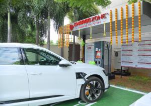 a white car parked in front of a gas station at Courtyard by Marriott Madurai in Madurai
