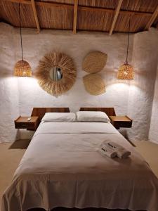เตียงในห้องที่ Kandire Posada Rural