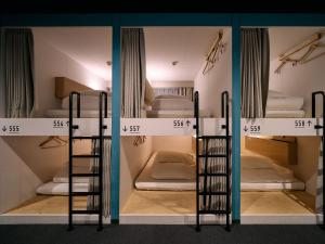 Postel nebo postele na pokoji v ubytování Hotel Plus Hostel TOKYO KAWASAKI
