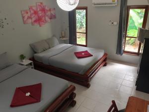 Postel nebo postele na pokoji v ubytování Tropical Paradise Leelawadee Resort + 37 fotografií