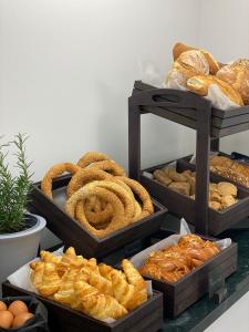 a display of different types of bread and pastries at Thess Residences in Thessaloniki