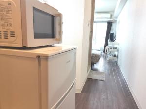 O bucătărie sau chicinetă la XL Shinjuku House