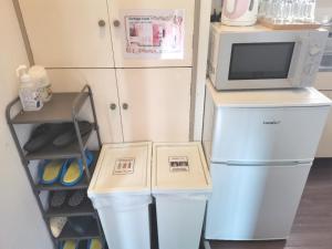 O bucătărie sau chicinetă la XL Shinjuku House