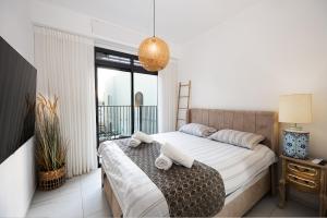 Rúm í herbergi á Villa Neil Yam Eilat